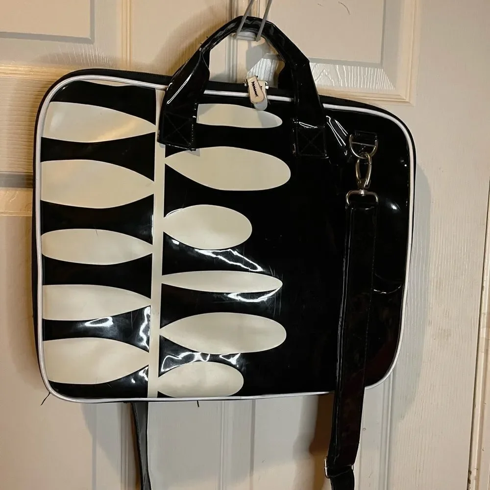 Black and white padded laptop bag with detachable padded shoulder strap